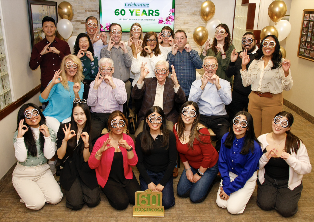The whole Queensway Optometric team in 2025 celebrating their 60 year anniversary